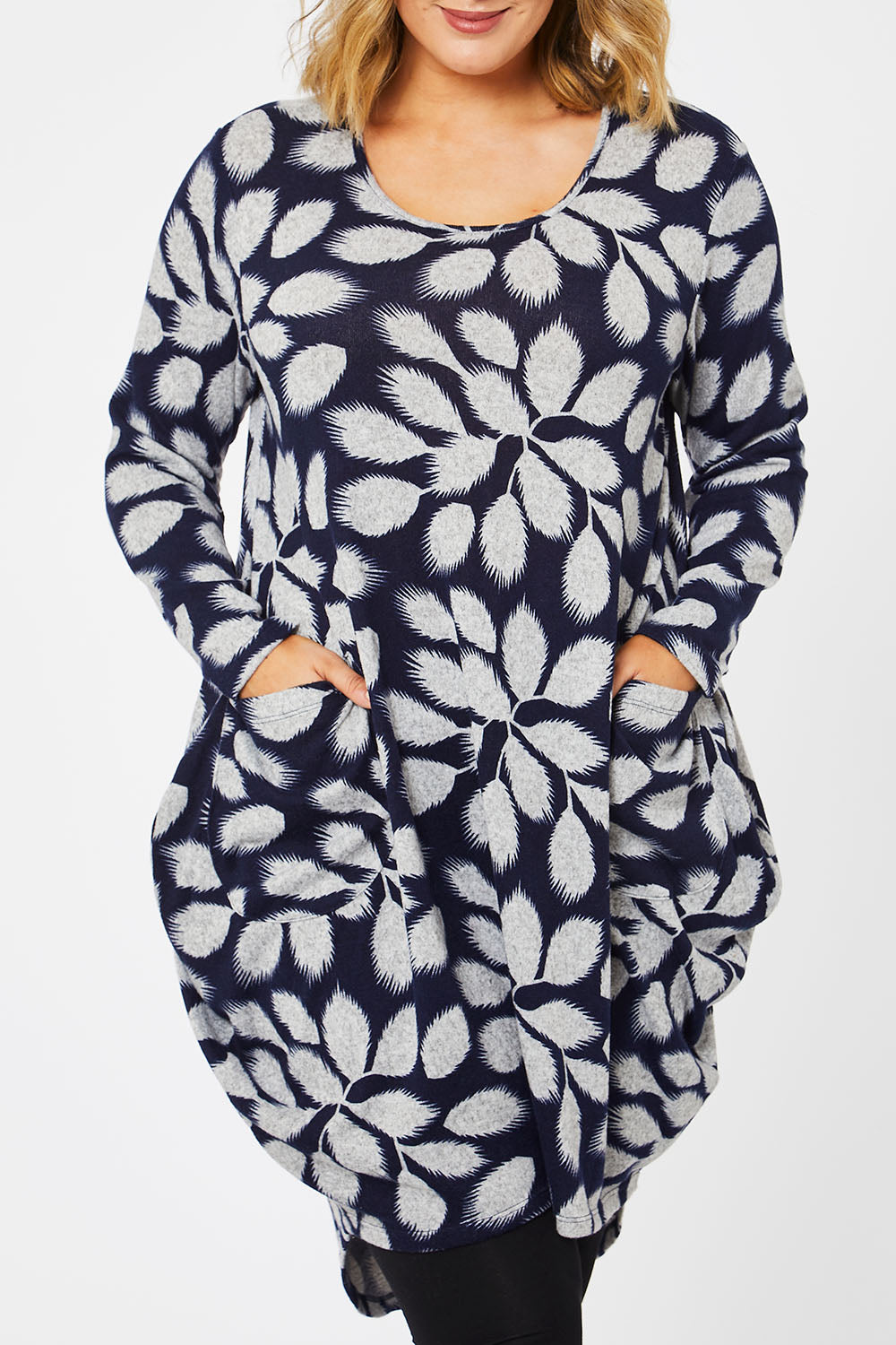 Model Jess wearing size 14 of The Cosy Pocket Detail Dress in colour Navyleaf (Blue), from the front, cropped image