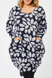Model Jess wearing size 14 of The Cosy Pocket Detail Dress in colour Navyleaf (Blue), from the front, cropped image