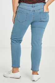 Model Fiona wearing size 16 of The Weekender Jeans in colour Lightdenim (Blue), from the back