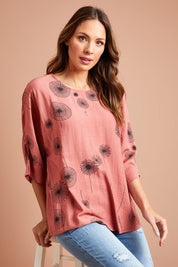 Model Madeline wearing size 10 of The Relax Fit Printed Top in colour Rosecopper (Pink), from the front, showing the whole outfit
