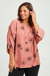 Model Monique wearing size 14 of The Relax Fit Printed Top in colour Rosecopper (Pink), from the front, cropped image