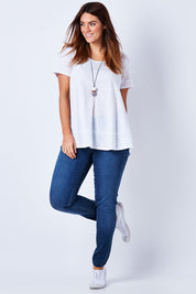 Model Laura wearing size 12 of The Everyday Jegging in colour Denim (Blue), from the front, showing the whole outfit