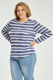 Model Fiona wearing size 16 of The Striped Curved Hem Long Sleeve Tee in colour Cornflower (Blue), from the front, cropped image