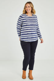Model Jess wearing size 14 of The Striped Curved Hem Long Sleeve Tee in colour Cornflower (Blue), from the front, showing the whole outfit