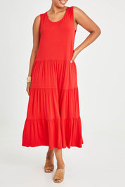 Model Noli wearing size 14 of The Tiered Tank Dress in colour Red (Red), from the front, cropped image