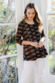 Model Tahlia wearing size 10 of The Printed Jersey 3/4 Sleeve Swing Tee in colour Multiprint (Black), from the front, showing the whole outfit