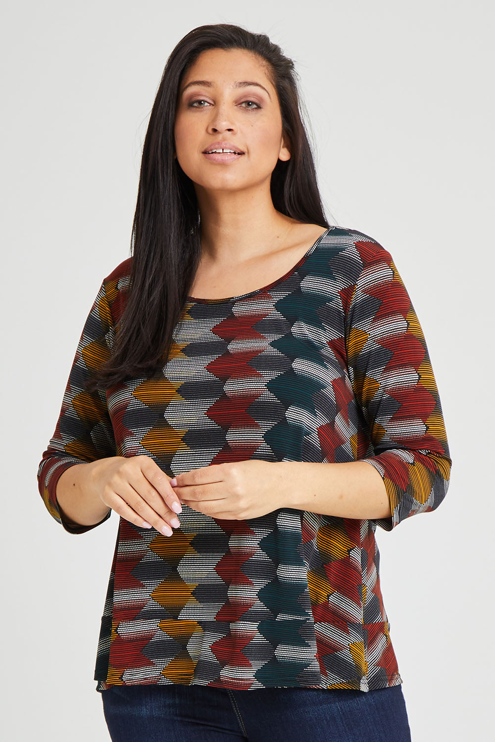 Model Terri-Leigh wearing size 14 of The Printed Jersey 3/4 Sleeve Swing Tee in colour Multiprint (Black), from the front, cropped image