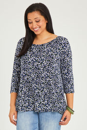 Model Terri-Leigh wearing size 14 of The Printed Jersey 3/4 Sleeve Swing Tee in colour Multispot (Blue), from the front, cropped image