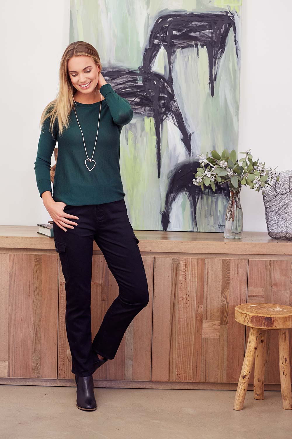 Model Nathalie wearing size 8 of The Straight Leg Cargo Pant in colour Black (Black), from the front, showing the whole outfit