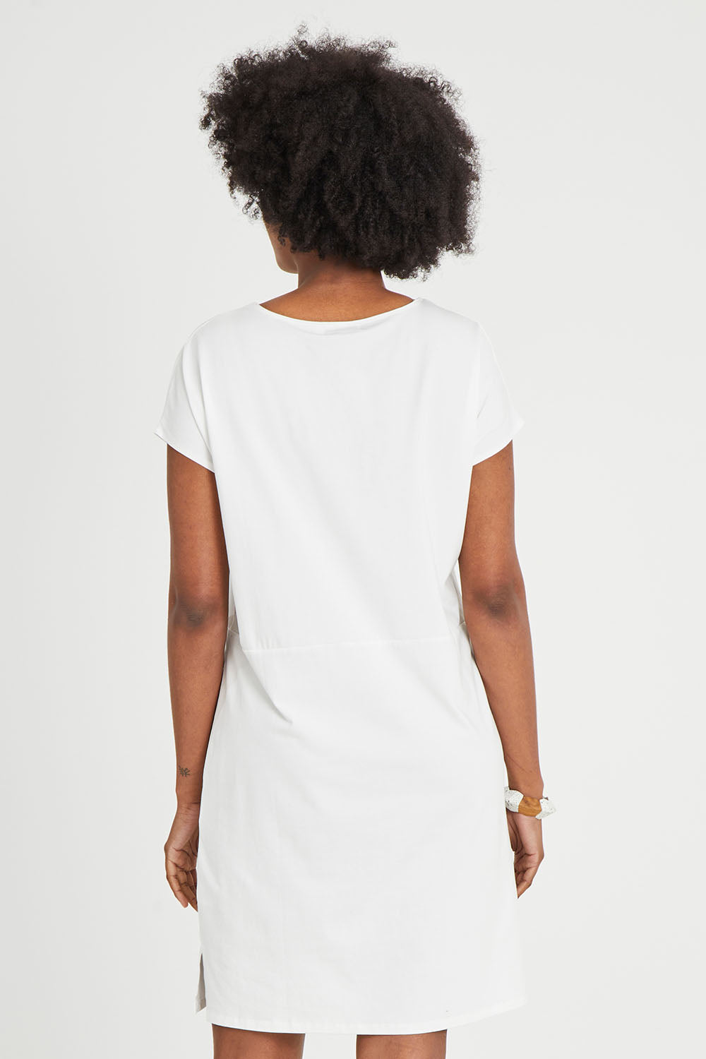 Model Aiyana wearing size 10 of The Luxe Cotton Tee Dress in colour White (White), from the back