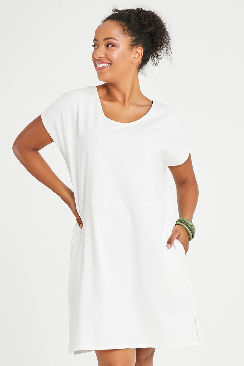 Model Noli wearing size 14 of The Luxe Cotton Tee Dress in colour White (White), from the front, cropped image