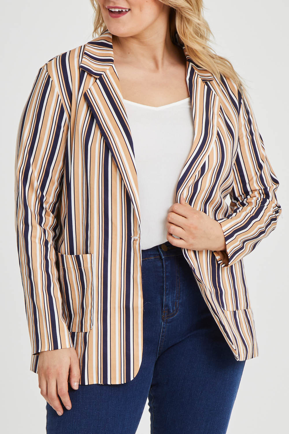 Model Keeara wearing size 16 of The Striped Boyfriend Blazer in colour Camelstrip, from the front, cropped image