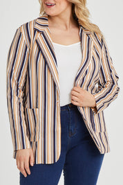 Model Keeara wearing size 16 of The Striped Boyfriend Blazer in colour Camelstrip, from the front, cropped image