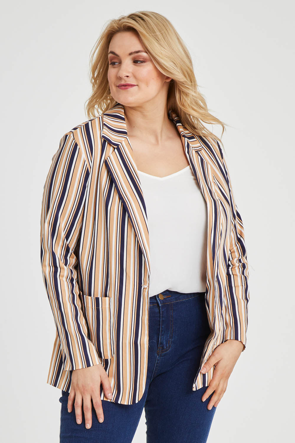 Model Keeara wearing size 16 of The Striped Boyfriend Blazer in colour Camelstrip, from the front, cropped image