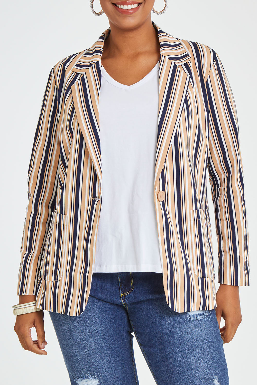 Model Noli wearing size 14 of The Striped Boyfriend Blazer in colour Camelstrip, from the front, cropped image
