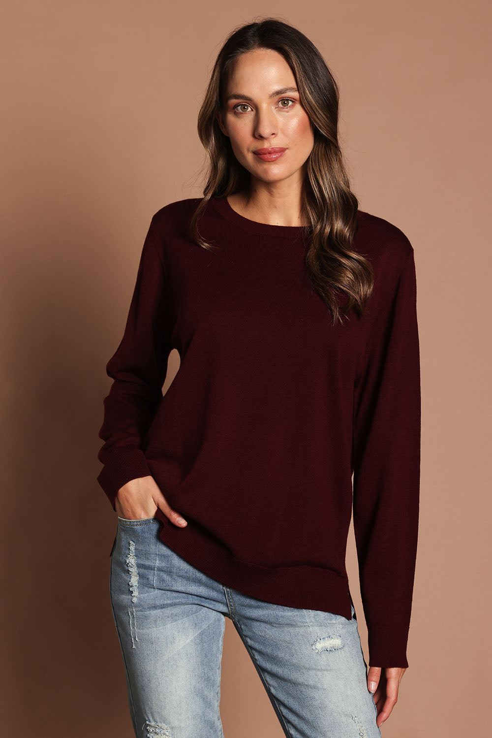 Model Madeline wearing size M of The Keepers Soft Round Neck Jumper in colour Firered (Red), from the front, showing the whole outfit