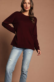 Model Madeline wearing size S of The Keepers Soft Round Neck Jumper in colour Firered (Red), from the front, showing the whole outfit
