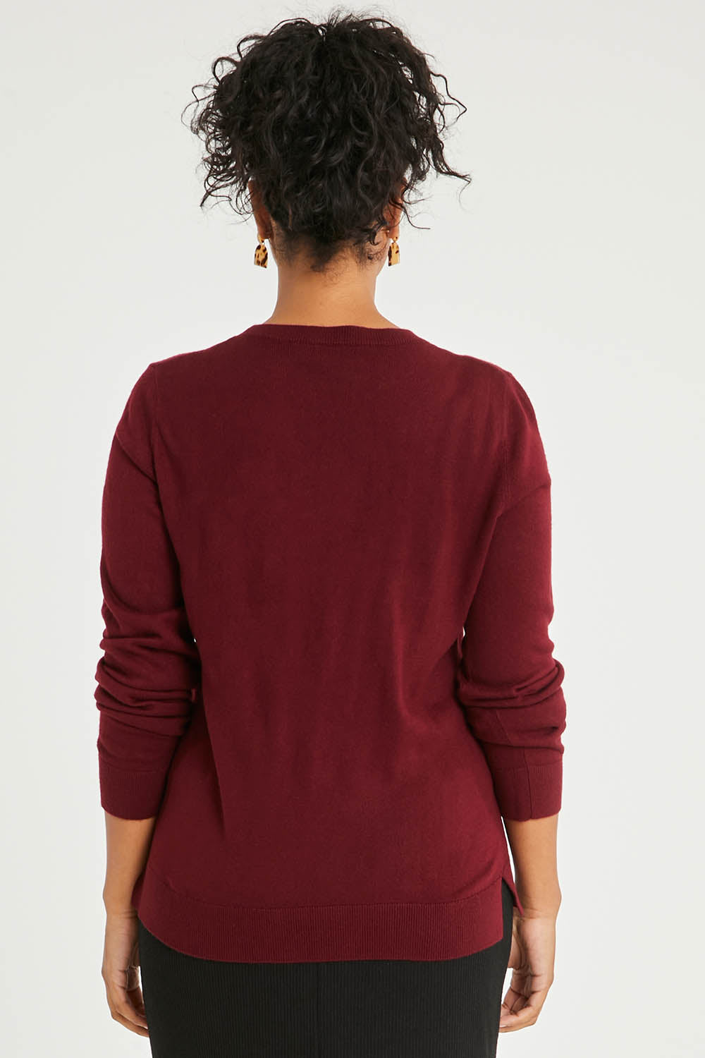 Model Noli wearing size L of The Keepers Soft Round Neck Jumper in colour Firered (Red), from the back