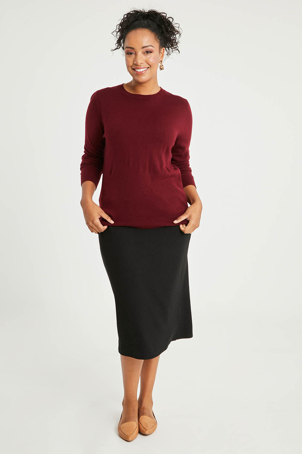 Model Noli wearing size L of The Keepers Soft Round Neck Jumper in colour Firered (Red), from the front, showing the whole outfit