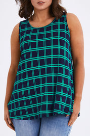 Model Monique wearing size 14 of The Printed Drape Tank in colour Navycheck (Blue), from the front, cropped image