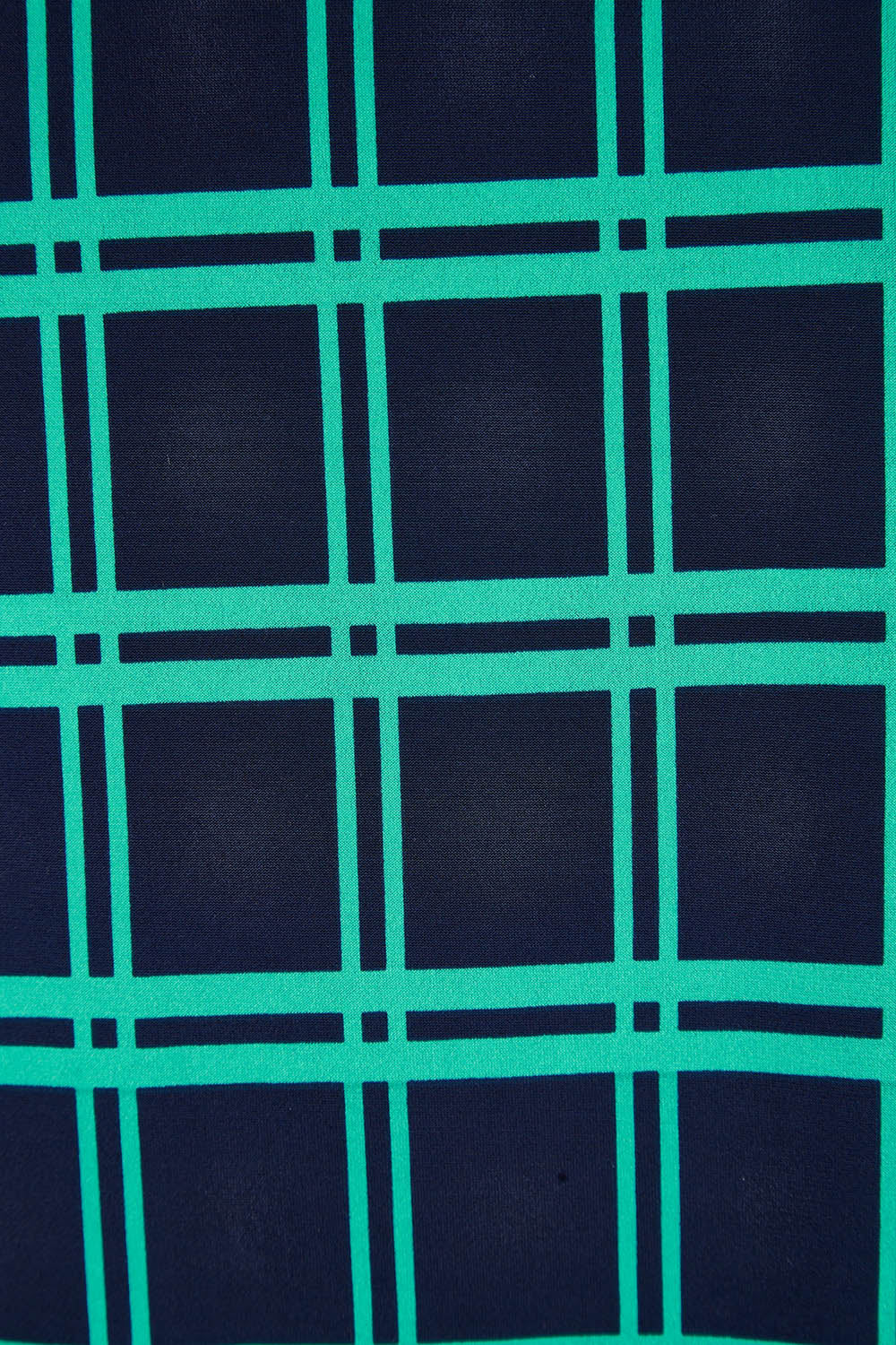 Product shot of The Printed Drape Tank in colour Navycheck (Blue), detail