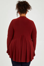 Model Alexis wearing size 16 of The Recycled Flounce Cardigan in colour Terracotta, from the back