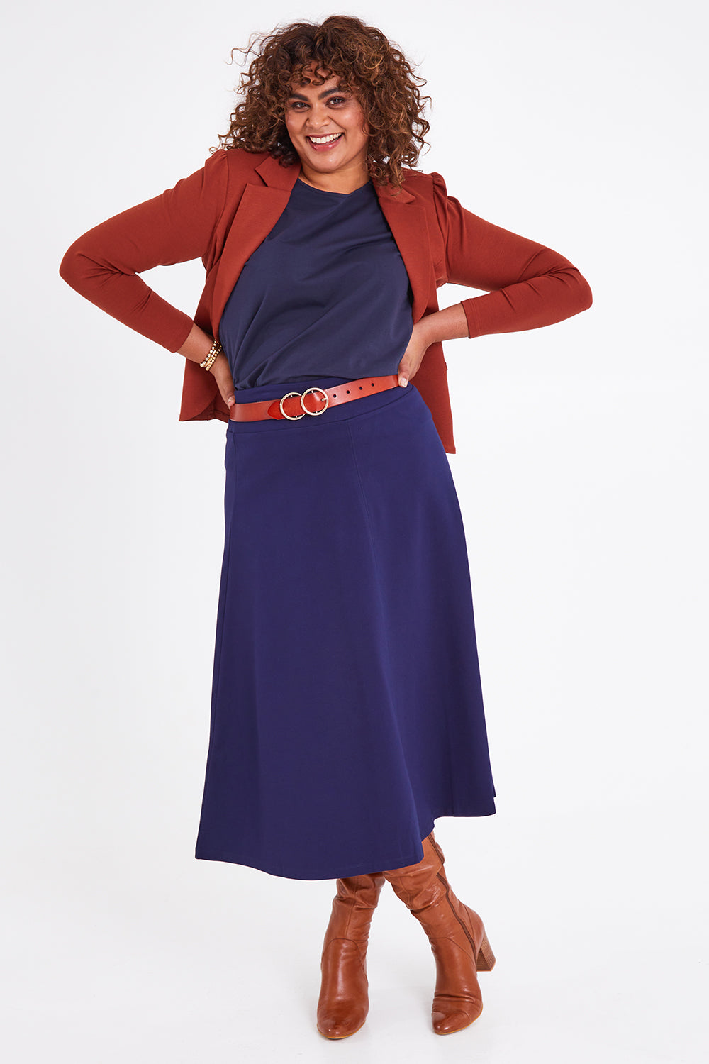 Model Anucia wearing size 14 of The Fit And Flare Ponte Skirt in colour Frenchnavy (Blue), from the front, showing the whole outfit