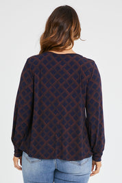 Model Noli wearing size 14 of The Keepers Printed Long Top in colour Multiprint (Blue), from the back