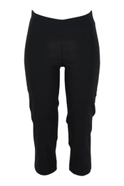 Product shot of The Contour Capri Pant in colour Black (Black), from the front