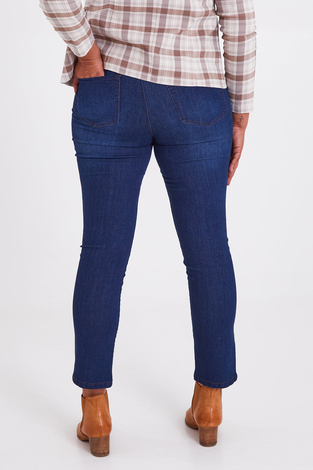 Model Anucia wearing size 14 of The Contour Jean in colour Darkdenim (Blue), from the back