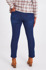Model Anucia wearing size 14 of The Contour Jean in colour Darkdenim (Blue), from the back