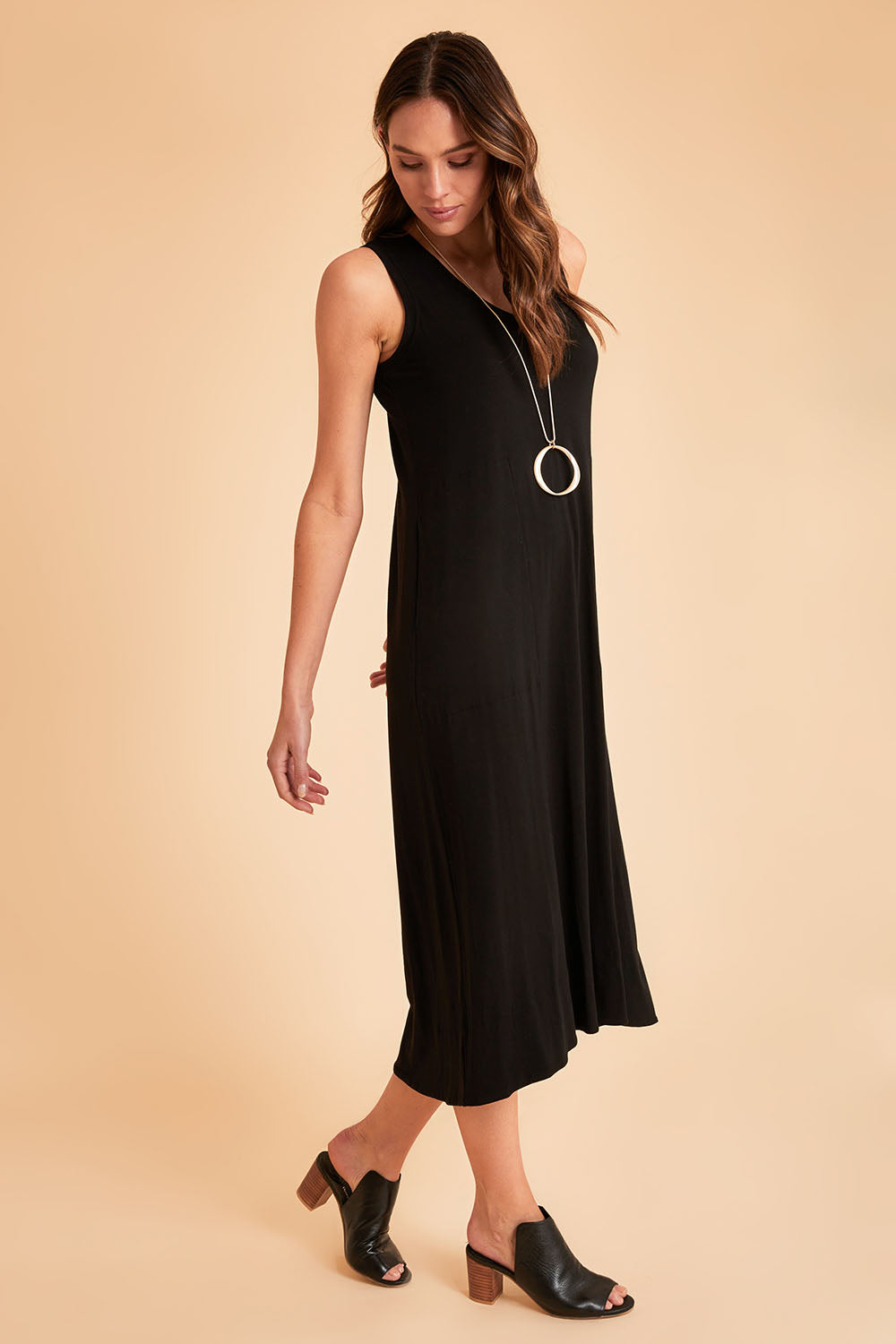 Model Madeline wearing size 10 of The Luxe Sleeveless Maxi Dress in colour Black (Black), from the front, showing the whole outfit