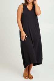 Model Monique wearing size 14 of The Luxe Sleeveless Maxi Dress in colour Black (Black), from the front, cropped image