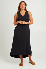 Model Monique wearing size 14 of The Luxe Sleeveless Maxi Dress in colour Black (Black), from the front, showing the whole outfit