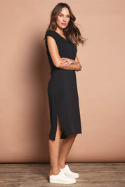 Model Madeline wearing size 10 of The Mid Length Tee Dress in colour Black (Black), from the front, showing the whole outfit