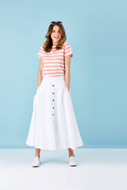 Model Helen wearing size 8 of The Button Up Midi Skirt in colour White (White), from the front, showing the whole outfit