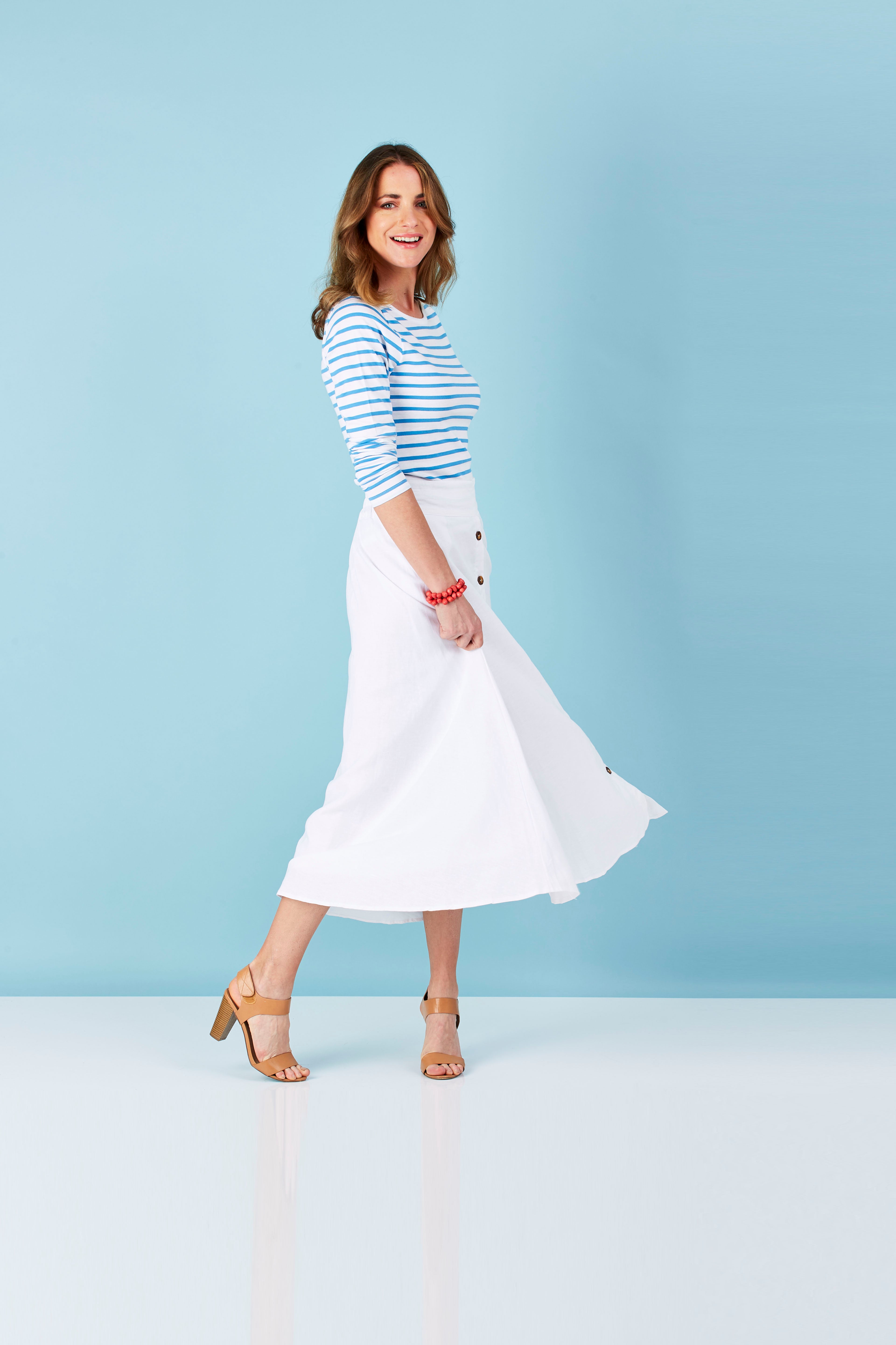 Model Helen wearing size 8 of The Button Up Midi Skirt in colour White (White)