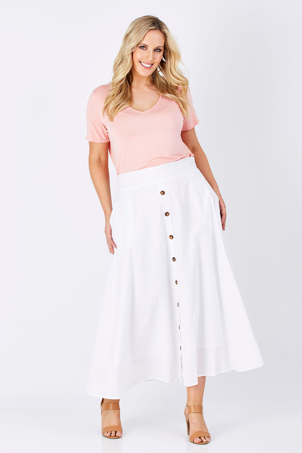 Model Jess wearing size 12 of The Button Up Midi Skirt in colour White (White), from the front, showing the whole outfit