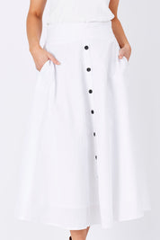 Model Maddy wearing size 10 of The Button Up Midi Skirt in colour White (White), from the front, cropped image