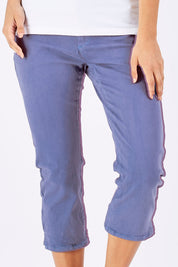 Model Georgia wearing size 10 of The 3/4 Stretch Jean in colour Blue (Blue), from the front, cropped image