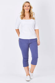 Model Jess wearing size 14 of The 3/4 Stretch Jean in colour Blue (Blue), from the front, showing the whole outfit