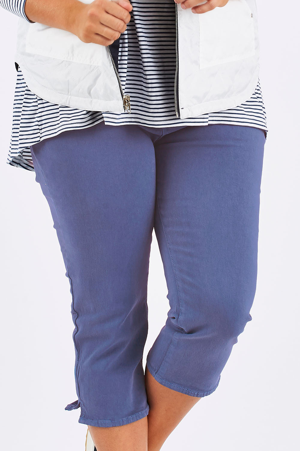 Model Mae wearing size 18 of The 3/4 Stretch Jean in colour Blue (Blue), from the front, cropped image