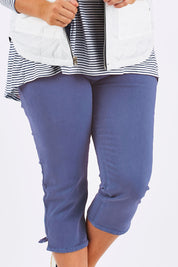 Model Mae wearing size 18 of The 3/4 Stretch Jean in colour Blue (Blue), from the front, cropped image