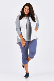 Model Mae wearing size 18 of The 3/4 Stretch Jean in colour Blue (Blue), from the front, showing the whole outfit