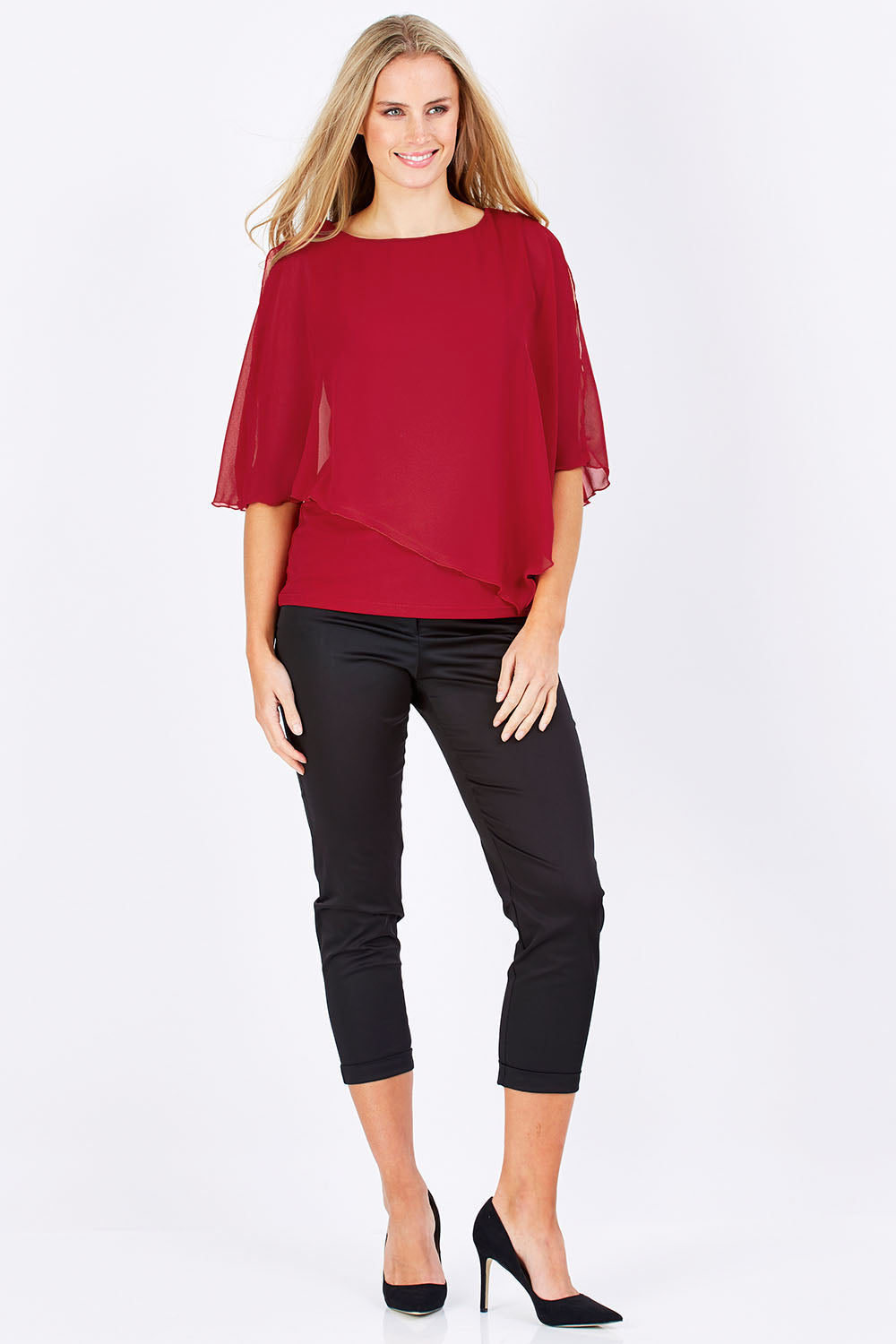 Model Maddy wearing size 10 of The Overlay Top in colour Red (Red), from the front, showing the whole outfit