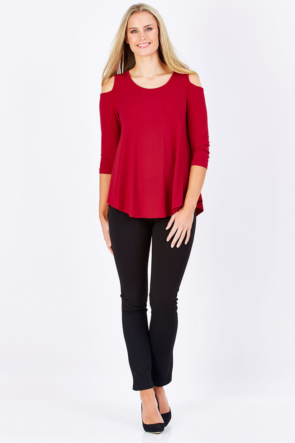 Model Maddy wearing size 10 of The Cut Out Shoulder Top in colour Red (Red), from the front, showing the whole outfit