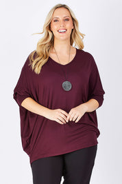Model Jess wearing size 14 of The V Neck Side Drape Tee in colour Wine (Purple), from the front, cropped image