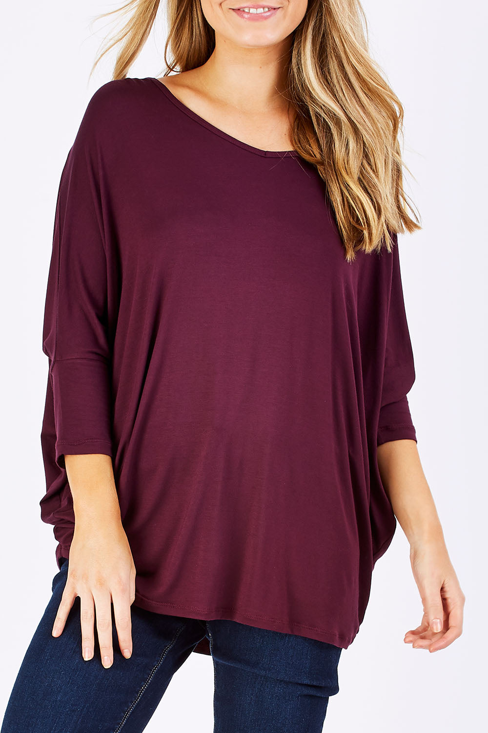 Model Marnee wearing size 10 of The V Neck Side Drape Tee in colour Wine (Purple), from the front, cropped image