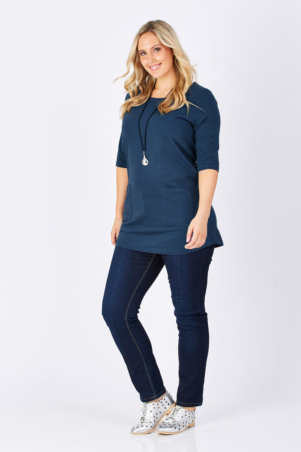 Model Jess wearing size 14 of The Pocket Tunic Top in colour Navy (Blue), from the front, showing the whole outfit