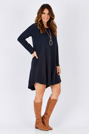 Model Laura wearing size 12 of The Long Sleeve Swing Dress in colour Navy (Blue), from the front, showing the whole outfit